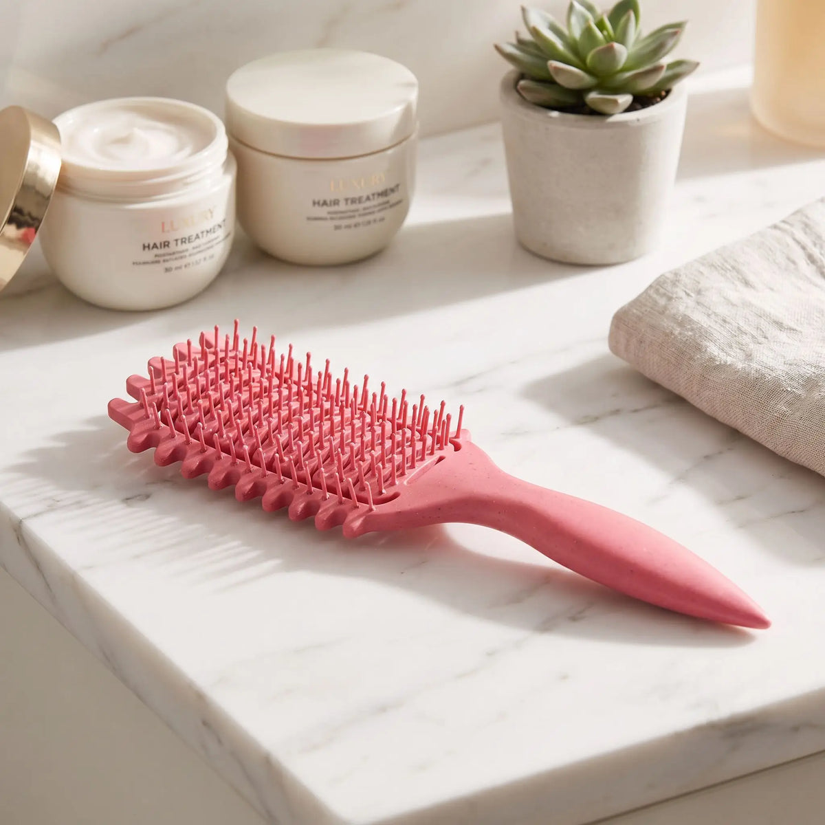Brosse cheveux bouclés rose